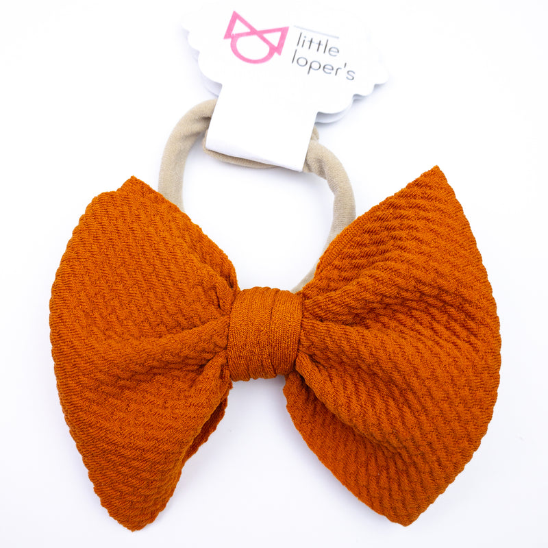 bright orange baby bow
